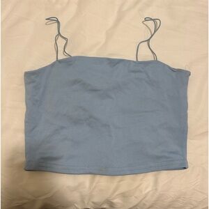 Light blue crop top with speghetti straps.